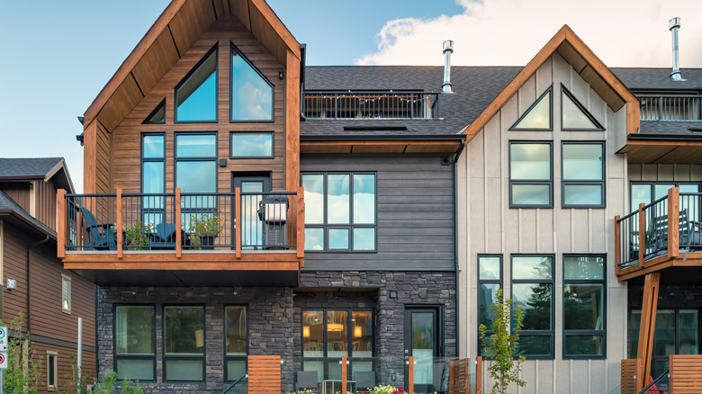Home that mixes wood, metal, siding, and stone on its exterior.