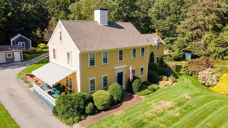 yellow colonial house exterior