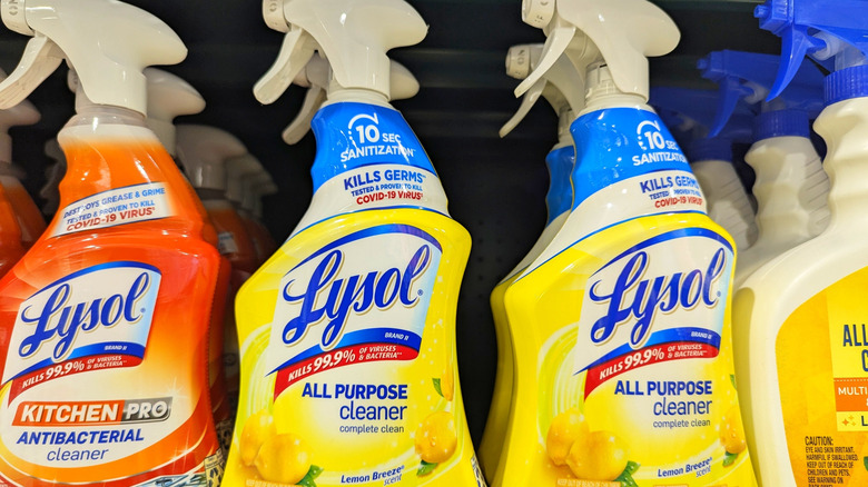 multiple bottles of lysol on store shelf