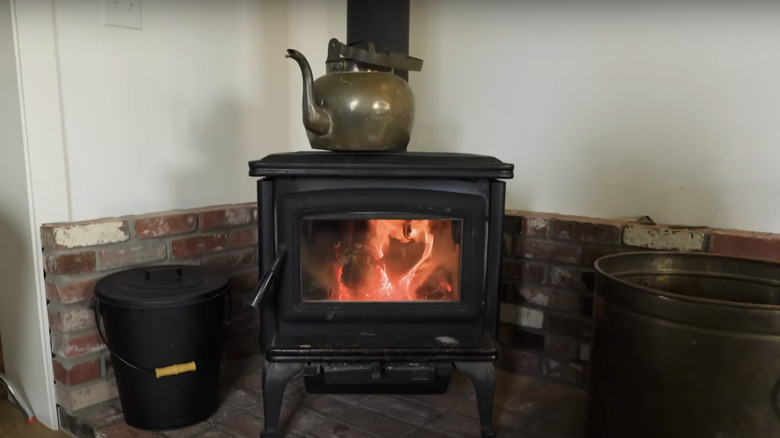 lit old fashioned wood burning stove