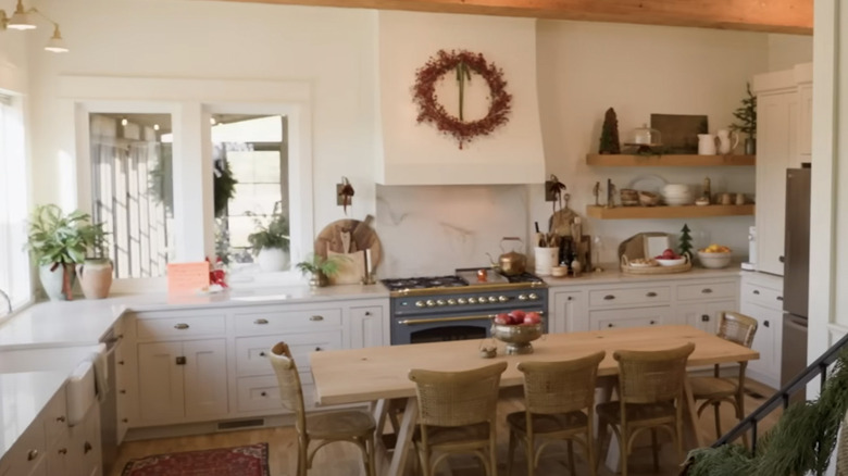 wooden kitchen table in white kitchen