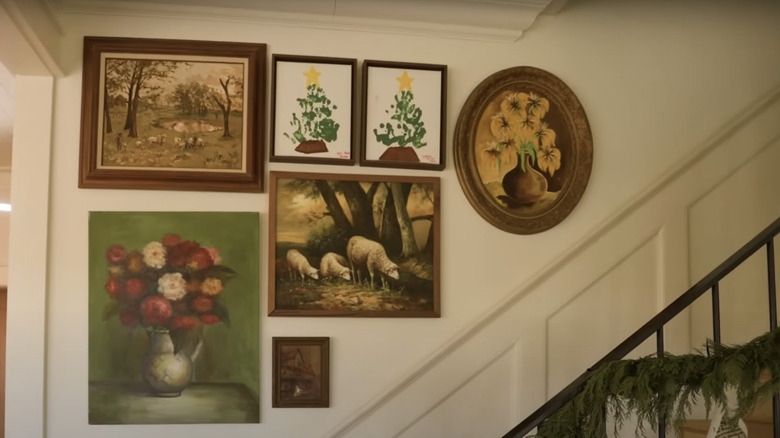 Framed paintings in stairwell