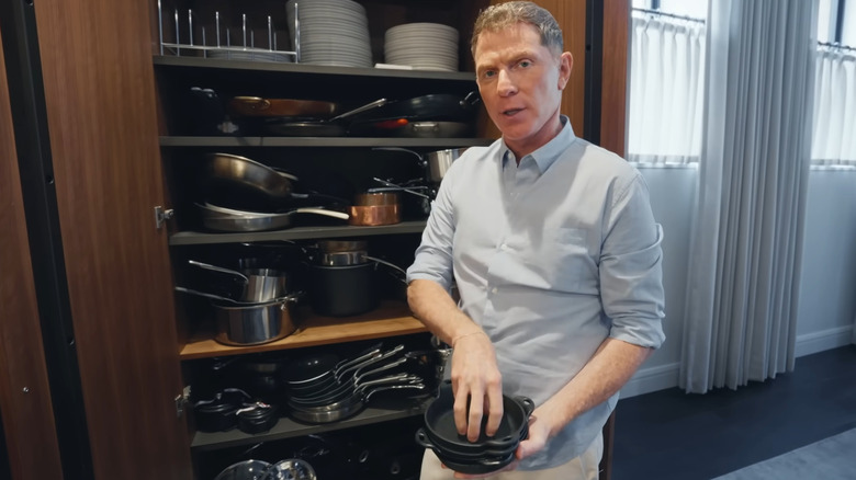 Bobby Flay shows off his collection of pots and pans.