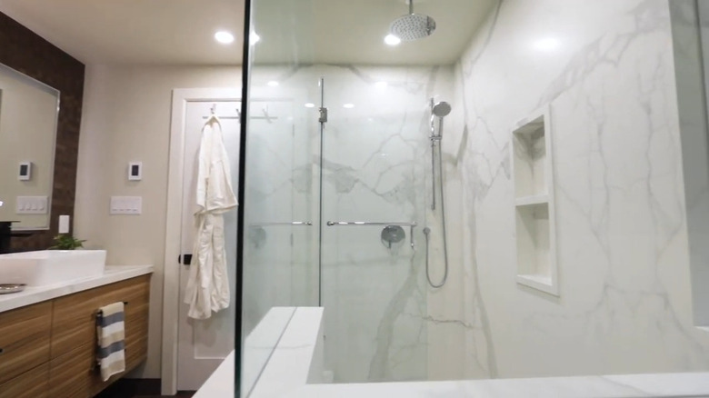A modern bathroom with a walk-in shower.