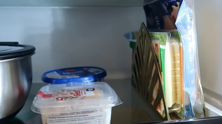 Napkin holder holding meat and cheese in the fridge