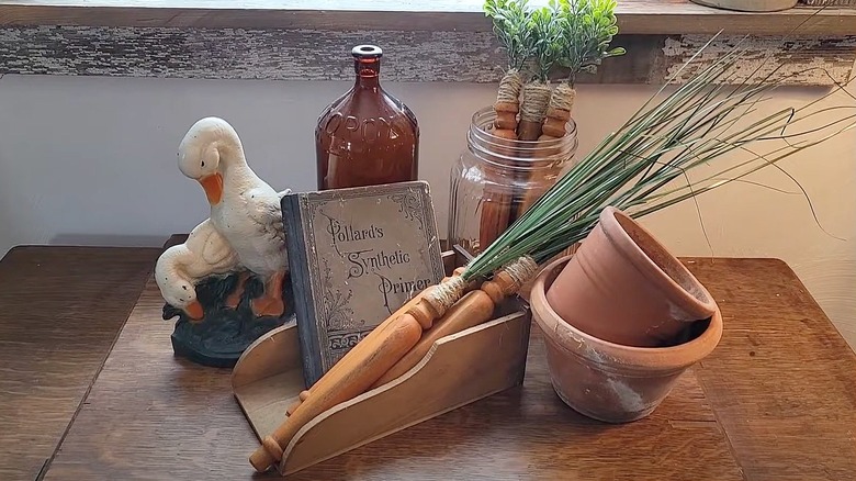 Wooden spindle carrots surrounded by rustic decor