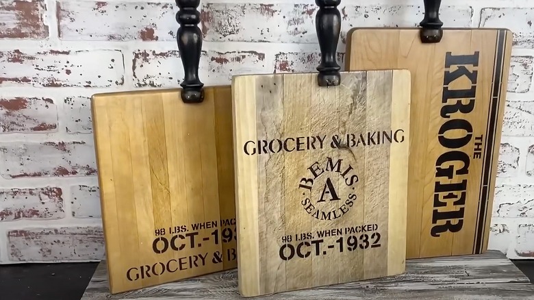 Wood cutting boards with spindles attached for handles