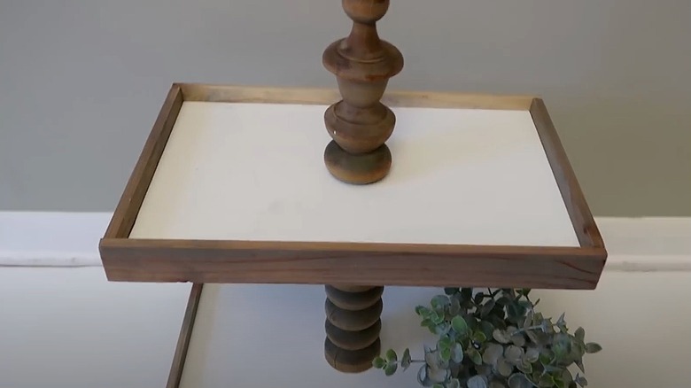 Tiered spindle tray with greenery