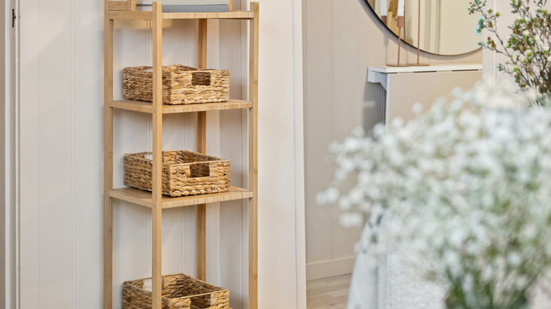 A wooden shelving unit with baskets