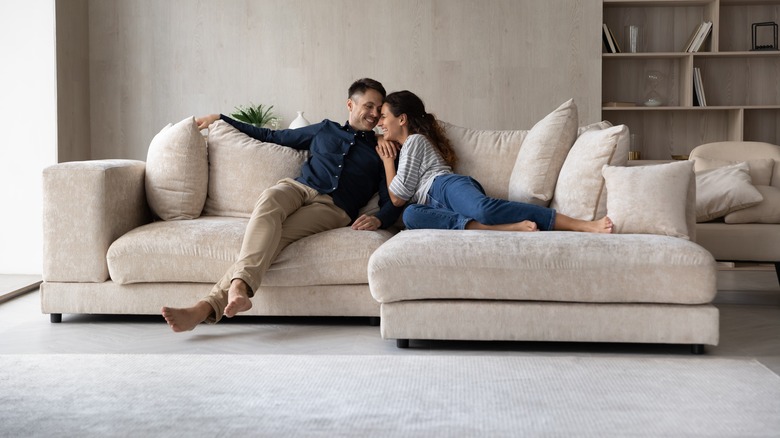 Couple cozy on sofa