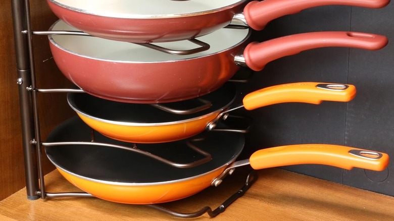 Pot organizer in a cabinet with pans