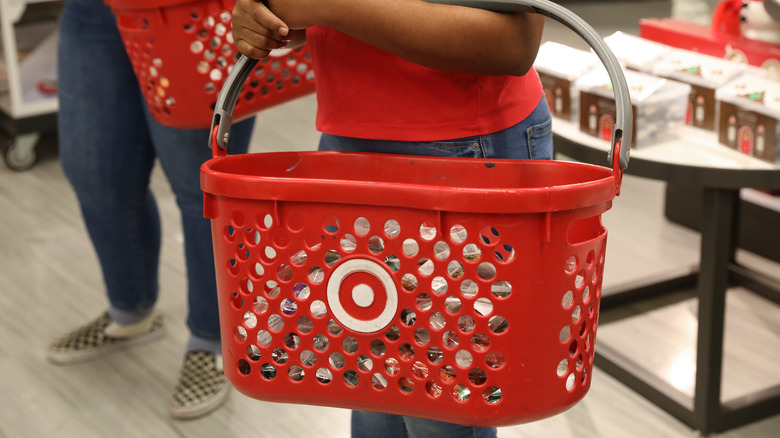 Person holding Target shopping basket