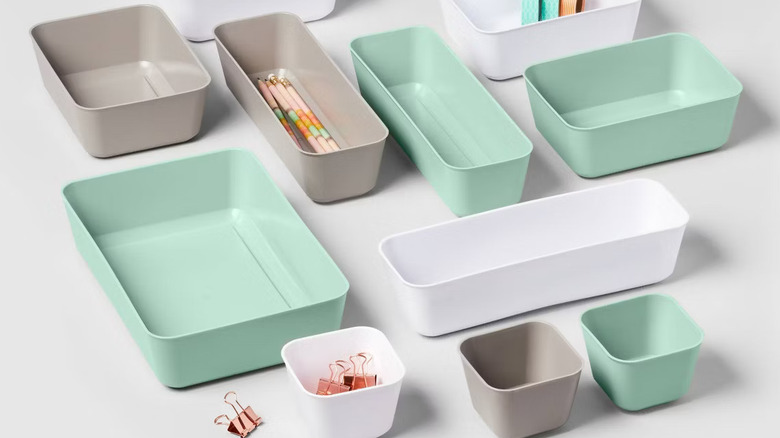 A collection of Brightroom's storage trays used to sort office supplies.