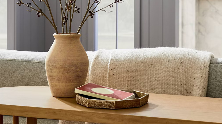 Threshold's Small Brass Tray displayed on top of a console table.