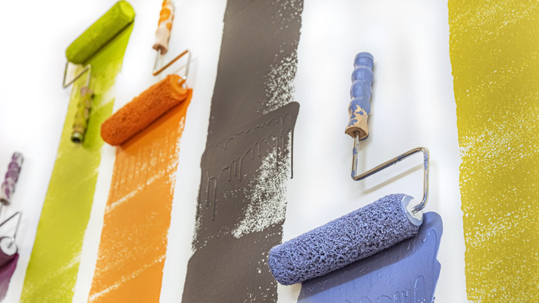 Colorful assorted paint colors applied to a white wall