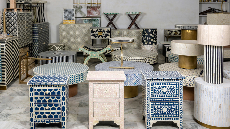 handcrafted luxury furniture collection rooted in traditional Indian craftsmanship, particularly bone inlay and mother of pearl work.