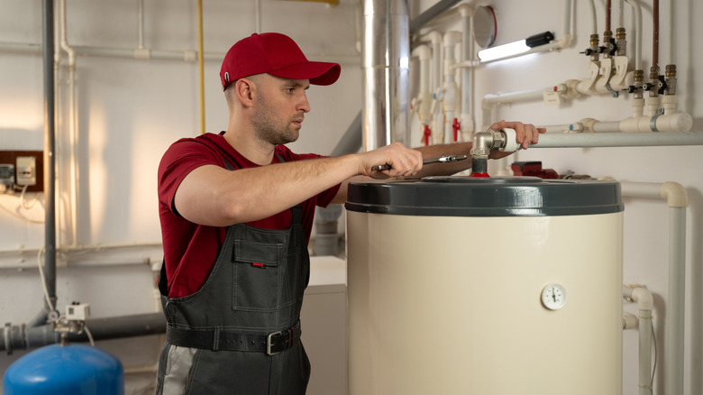 Plumber working on water heater
