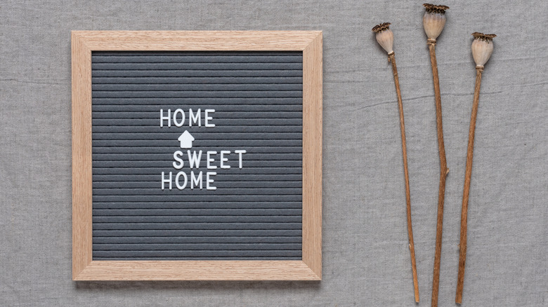 A vintage letter board that reads: "home, sweet home," on it.