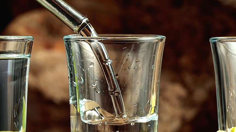Tequila being poured in glass