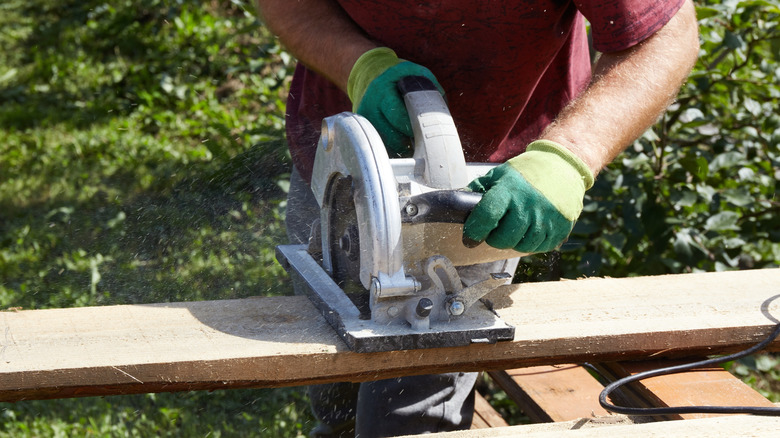 A man using a circular saw