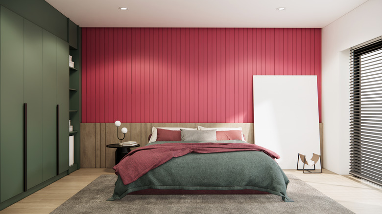 Medium rose pink walls with green cupboards and a green bedspread