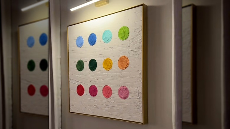 A textured canvas featuring 12 colorful painted circles.