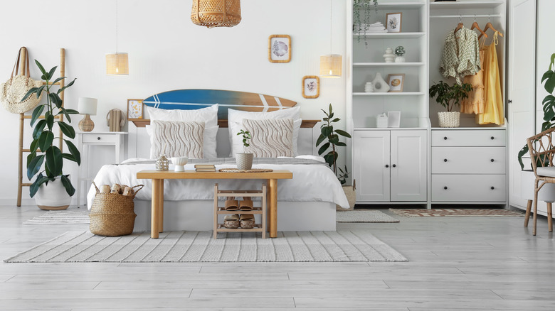 A white living room with whitewashed floors and light wood accents