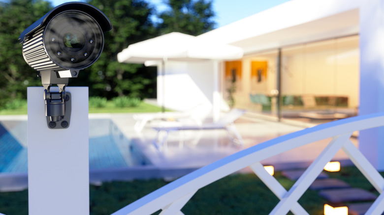 Security camera near home facing forward, pointing away from home and pool