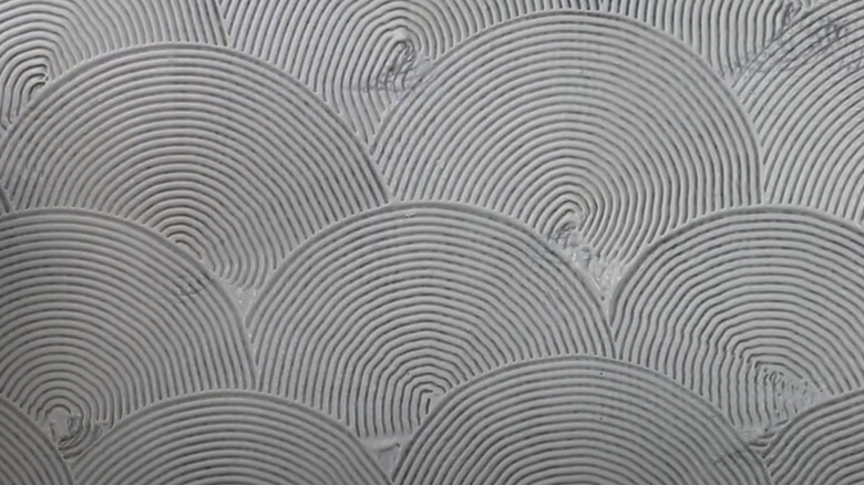 A fan pattern ceiling texture is shown in detail