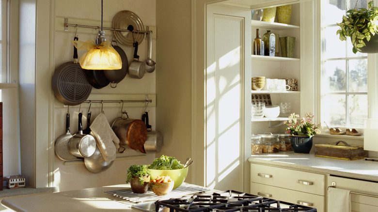 Cozy kitchen with pot and utensil rack