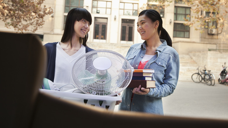 Woman moving into college dorm