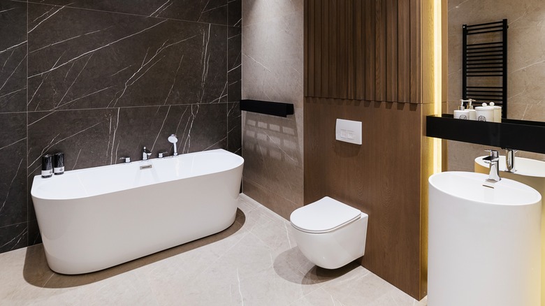 black, white, and wood bathroom