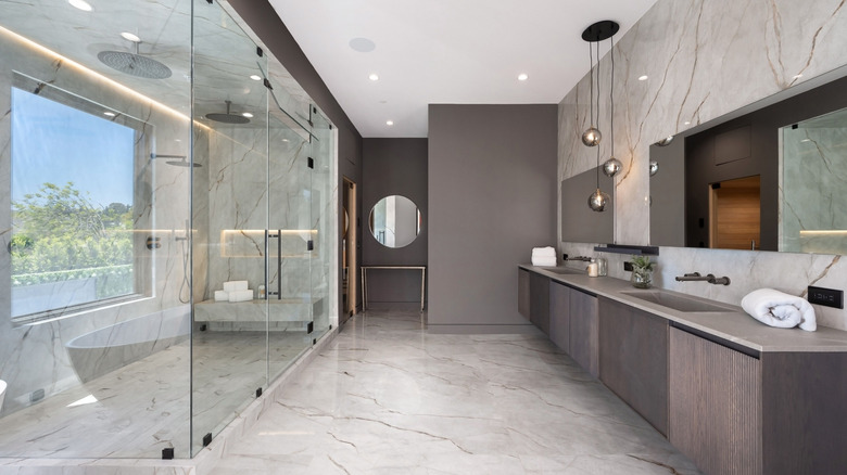 Large glass shower with double showers in a luxurious bathroom