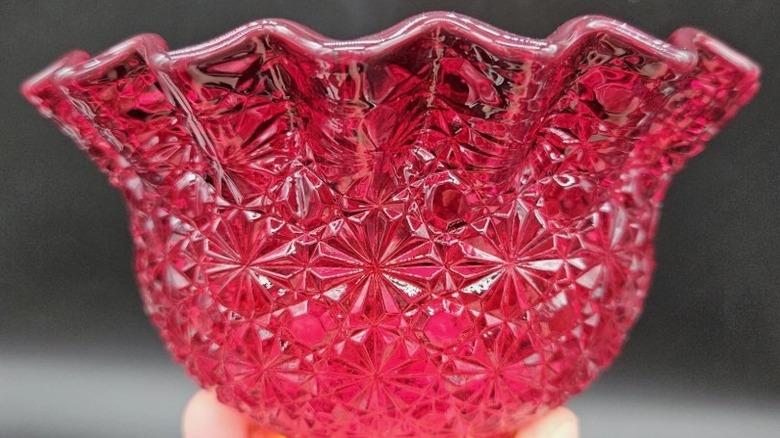 Cadmium depression glass piece daisy and button pattern