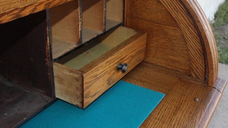 Pin and cove joined drawer on 1800s oak roll top desk