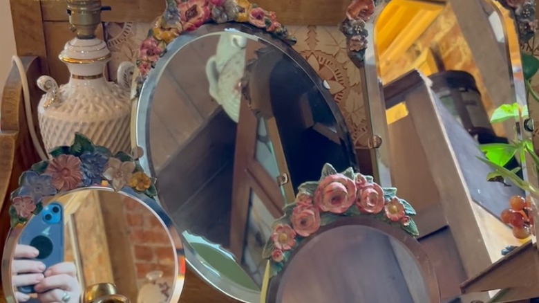 A collection of Barbola mirrors in an antique store