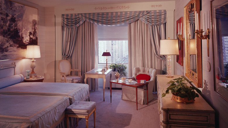 Retro '80s bedroom design with elegant fabrics and eclectic decor