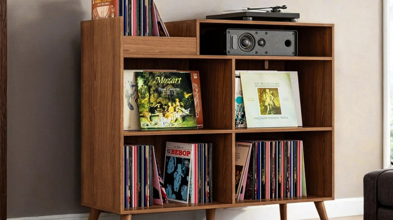 The George Oliver record stand with a speaker and turntable on the top shelves.
