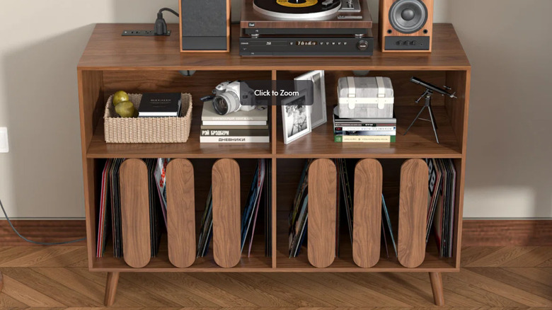 George Oliver record player stand with baskets, camera, books, and a turntable.