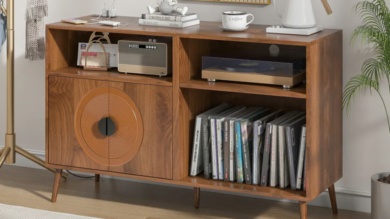 The Latitude Run audio cabinet filled with accessories and books.
