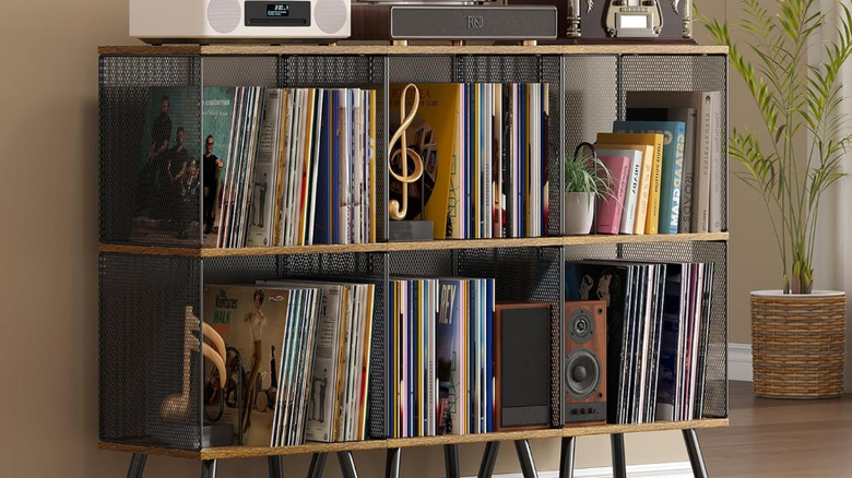 Three of the X-cosrack 3-tier record player stands placed next to each other.