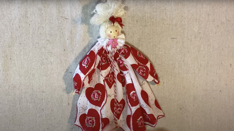 A doll made from a Valentine's Day-themed vintage handkerchief.