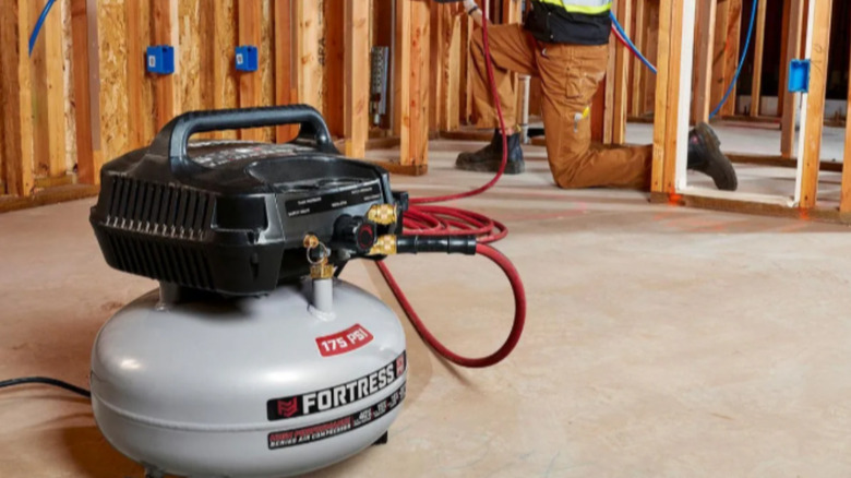 a fortress 175 psi air compressor is being used on a construction site