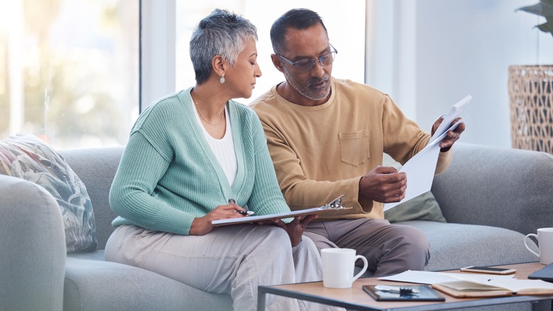 senior couple looking at paperwork