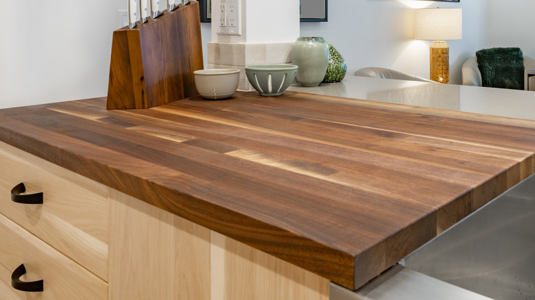 A solid butcher's block counter used in a kitchen