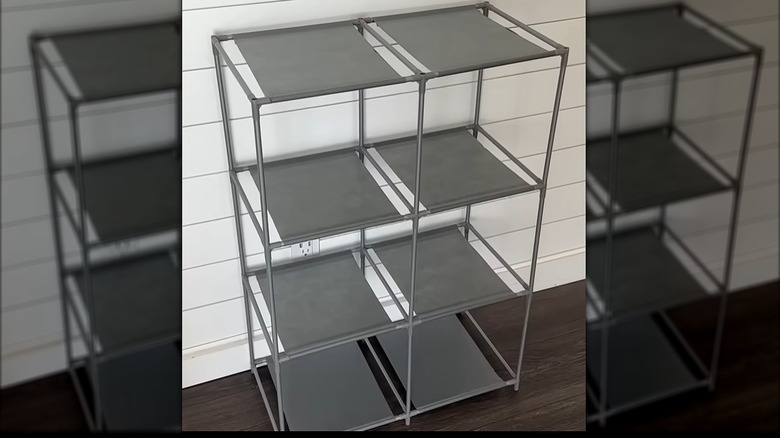 A Dollar Tree 6-cube storage shelf is ready to hold bathroom items.