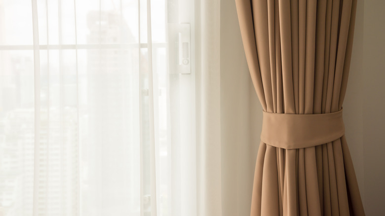 brown curtains on window