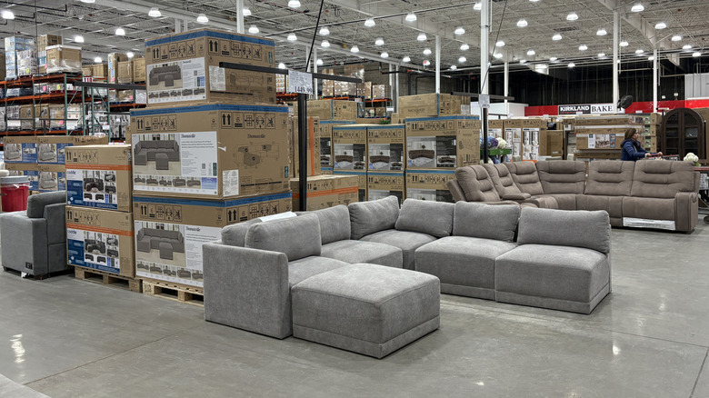 Furniture items on sale in a Costco warehouse