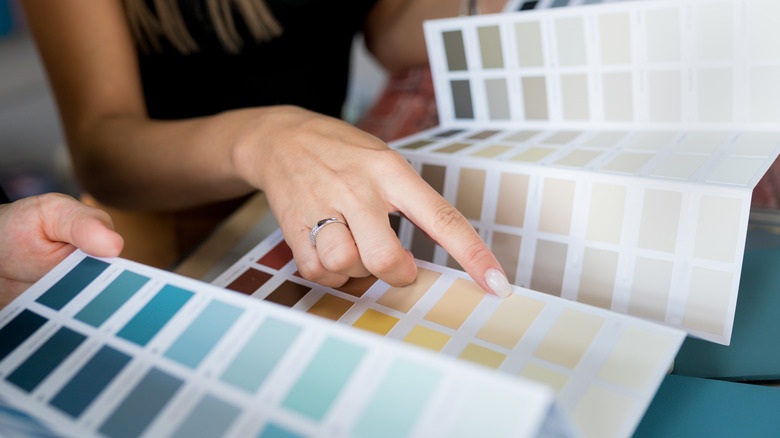 Woman browsing paint swatches