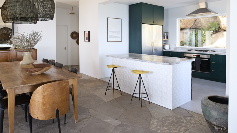 Open layout space with kitchen island and dining table